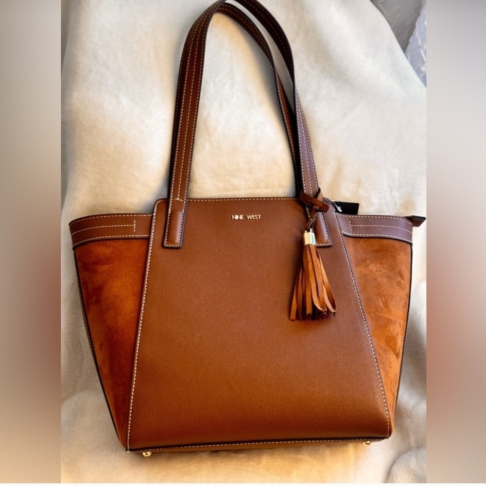 Nine West Tan faux Suede Stylish Trendy and Chic Handbag with Tassel detail